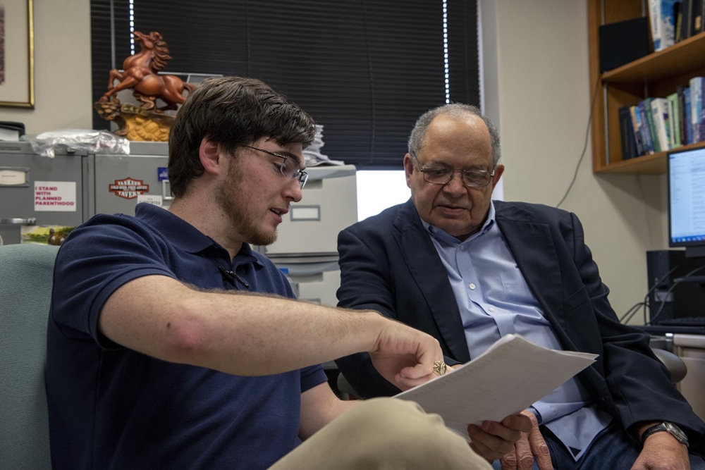 Donald Darensbourg speaking with a student in his office